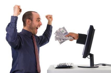 man getting excited about money coming from a computer screen.